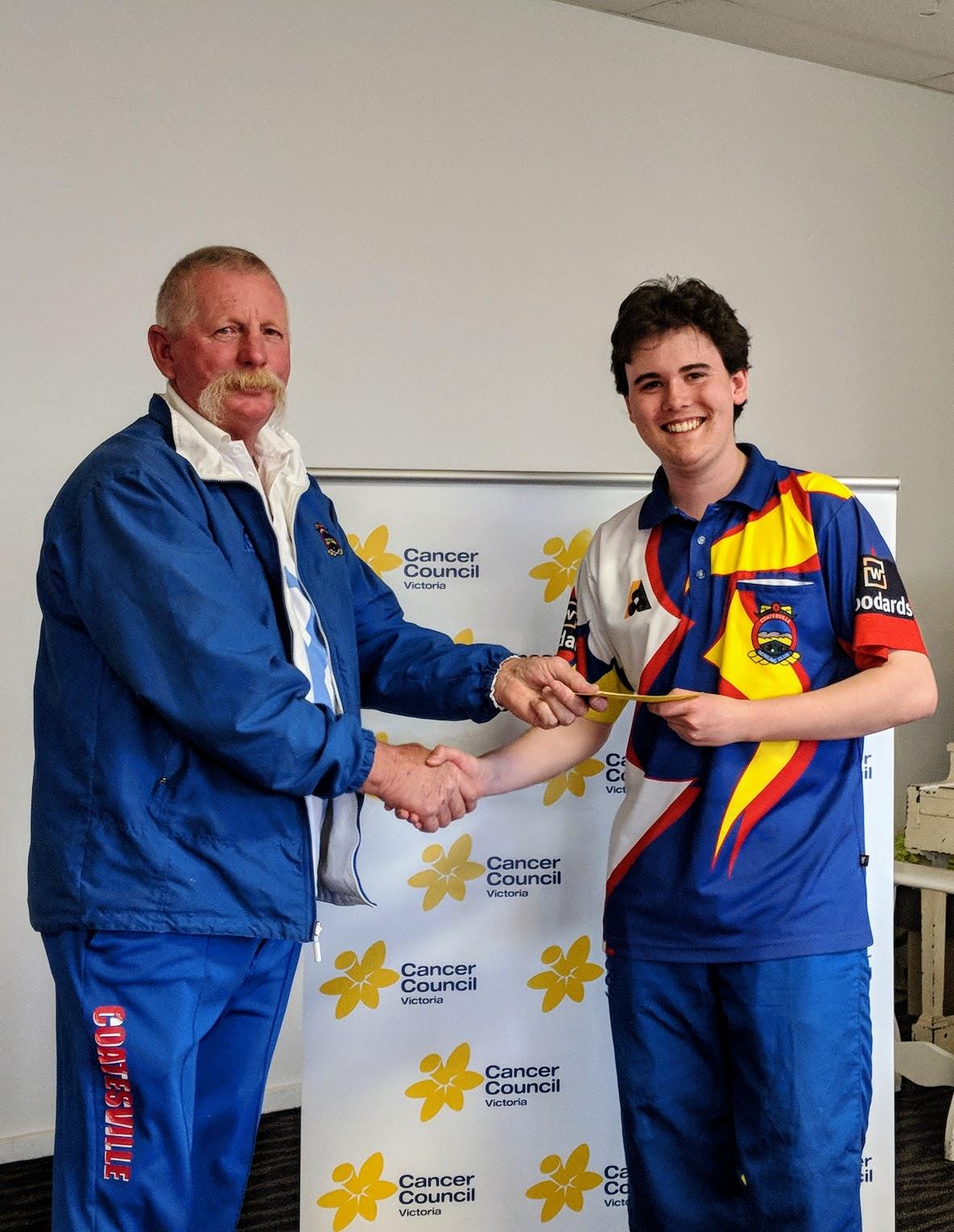 Accepting a prize at the &ldquo;Charcoal Challenge&rdquo;, a charity bowls day