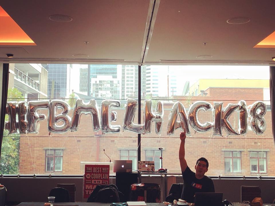 A balloon sign with the hackathon&rsquo;s social media hashtag