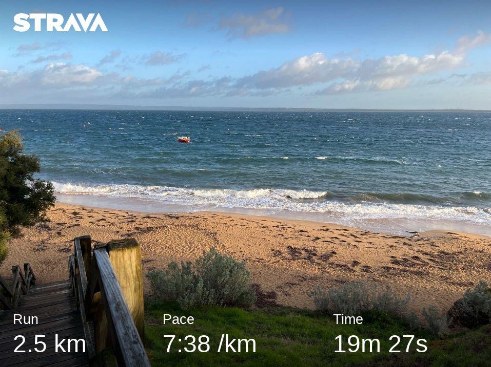Statistics from a Strava run overlaid on a beach backdrop, 2.5km in 19 minutes 27 seconds